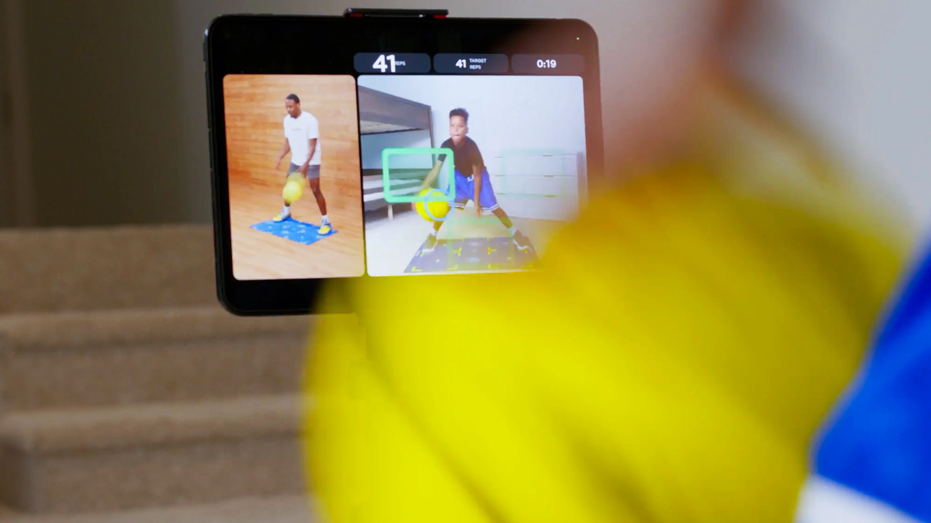 Dribbleup app on a tablet tracking the Silent Smart Basketball mid-drill with a coach demo and live rep counter